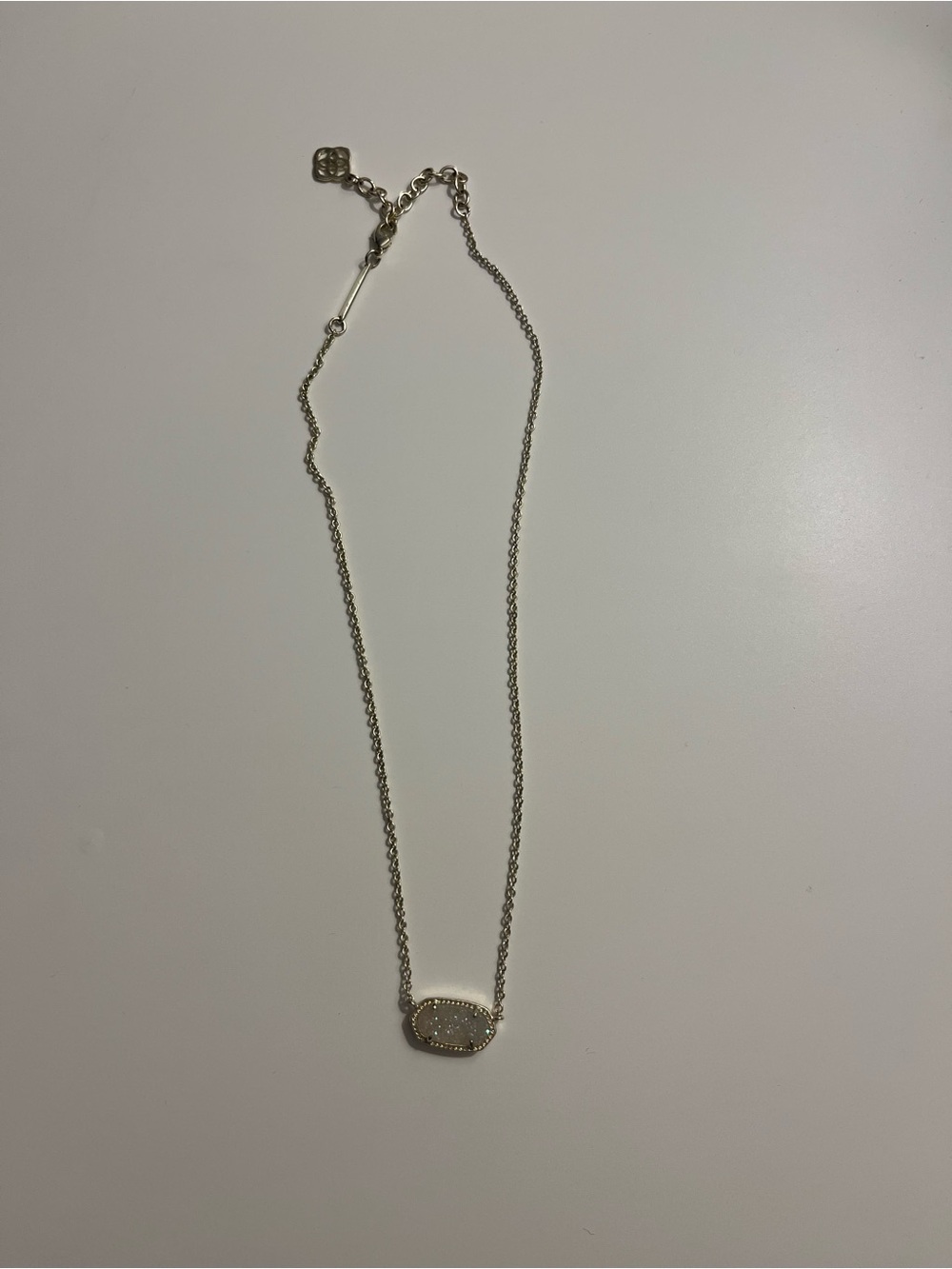 Gold Kendra Scott white sparkle pendant